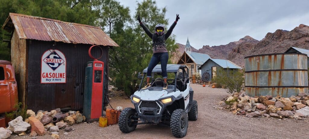 woman on top of RZR in a gold mine tour in las vegas